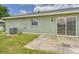 Grassy backyard with a patio, offering a relaxing outdoor space for homeowners at 91 W Cedarwood Cir, Kissimmee, FL 34743