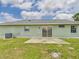 Backyard featuring a concrete patio, lawn, and easy access to outdoor enjoyment at 91 W Cedarwood Cir, Kissimmee, FL 34743