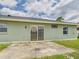 Backyard featuring a concrete patio perfect for relaxing and entertaining at 91 W Cedarwood Cir, Kissimmee, FL 34743
