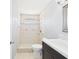 Bathroom with tile shower, toilet, and vanity featuring a sink at 91 W Cedarwood Cir, Kissimmee, FL 34743