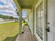 A white front door with glass and lock with brick path at 91 W Cedarwood Cir, Kissimmee, FL 34743