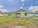 Single Gathering home showing the exterior, front yard and driveway on a sunny day at 91 W Cedarwood Cir, Kissimmee, FL 34743