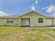 Charming single-story home with a spacious front yard and attached garage at 91 W Cedarwood Cir, Kissimmee, FL 34743