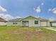 Charming single-story home with a spacious front yard and attached garage at 91 W Cedarwood Cir, Kissimmee, FL 34743