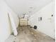 Unfinished garage featuring an automatic garage door at 91 W Cedarwood Cir, Kissimmee, FL 34743