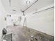 Spacious garage featuring laundry tub, garage door opener, and ample room for parking and storage at 91 W Cedarwood Cir, Kissimmee, FL 34743