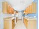 Kitchen features wood cabinets and appliances at 91 W Cedarwood Cir, Kissimmee, FL 34743