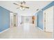 Spacious open concept living room with ceiling fan at 91 W Cedarwood Cir, Kissimmee, FL 34743