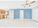 Living room view leading into the kitchen at 91 W Cedarwood Cir, Kissimmee, FL 34743