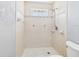 A shower with tiled walls and a window block detail at 91 W Cedarwood Cir, Kissimmee, FL 34743