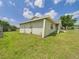 Well-maintained side yard with green grass at 91 W Cedarwood Cir, Kissimmee, FL 34743