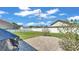 Backyard featuring a brick patio and a white fence for privacy at 9502 Waterford Oaks Blvd, Winter Haven, FL 33884
