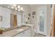 Bathroom with granite countertops, double sinks and door to outdoor patio at 9502 Waterford Oaks Blvd, Winter Haven, FL 33884