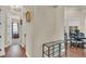 Hallway featuring hardwood floors and an elegant glass table at 9502 Waterford Oaks Blvd, Winter Haven, FL 33884