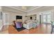 Elegant living room with hardwood floors, high ceilings, chandelier, and stylish furnishings at 9502 Waterford Oaks Blvd, Winter Haven, FL 33884