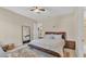 Spacious primary bedroom with ensuite bath and neutral color palette at 9502 Waterford Oaks Blvd, Winter Haven, FL 33884