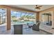 Covered patio featuring outdoor seating with views of pool and backyard at 9502 Waterford Oaks Blvd, Winter Haven, FL 33884