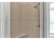 Walk in shower with a built in seat and updated shower head at 9502 Waterford Oaks Blvd, Winter Haven, FL 33884