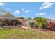 Fenced backyard featuring lawn, landscaping, and a stone path at 995 14Th Ne St, Winter Haven, FL 33881