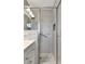 Beautiful bathroom with a glass shower featuring stylish tiling and a convenient grab bar at 995 14Th Ne St, Winter Haven, FL 33881