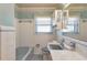 Vintage style bathroom with blue fixtures and ample lighting at 995 14Th Ne St, Winter Haven, FL 33881