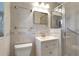 Nicely tiled bathroom featuring a glass enclosed shower, modern fixtures, and vanity at 995 14Th Ne St, Winter Haven, FL 33881