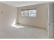 Neutral bedroom with carpet and a window, awaiting personal touches and decor at 995 14Th Ne St, Winter Haven, FL 33881