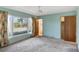 Bright bedroom with a large window and ceiling fan, providing natural light and ventilation at 995 14Th Ne St, Winter Haven, FL 33881