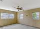 Bedroom featuring multiple windows and a ceiling fan at 995 14Th Ne St, Winter Haven, FL 33881