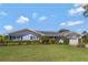Charming single-story home with a well-manicured lawn and appealing landscaping at 995 14Th Ne St, Winter Haven, FL 33881