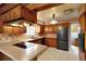 Functional kitchen with appliances and wood cabinetry at 995 14Th Ne St, Winter Haven, FL 33881