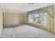 Spacious living room with large window providing natural light at 995 14Th Ne St, Winter Haven, FL 33881