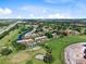 Beautiful aerial view of golf community condos with a canal running through and lush landscaping at 1104 Country Club Dr # A-4, Lake Wales, FL 33898