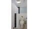 Clean bathroom featuring a toilet and shower with patterned shower curtain at 1104 Country Club Dr # A-4, Lake Wales, FL 33898