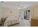 Bright bedroom with wood flooring, a sliding glass door, and access to an outside patio at 1104 Country Club Dr # A-4, Lake Wales, FL 33898
