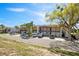 Exterior view of a condo complex with balconies, parking, and mature trees at 1104 Country Club Dr # A-4, Lake Wales, FL 33898