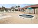 Inviting community hot tub with a lounge seating area and umbrellas perfect for a relaxing day at 1104 Country Club Dr # A-4, Lake Wales, FL 33898