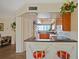 Bright kitchen with updated cabinets, a breakfast bar, and lots of natural light at 1104 Country Club Dr # A-4, Lake Wales, FL 33898