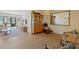 Bright living room featuring hardwood floors, a large mirror and comfortable seating at 1104 Country Club Dr # A-4, Lake Wales, FL 33898