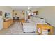 Well-lit living room boasts an open floorplan, modern décor, and access to other living spaces at 1104 Country Club Dr # A-4, Lake Wales, FL 33898
