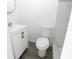 White sink and toilet, with walk-in shower, in updated bathroom at 1328 3Rd Ne St, Winter Haven, FL 33881