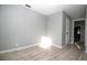 This bright bedroom features neutral walls and durable flooring at 1328 3Rd Ne St, Winter Haven, FL 33881