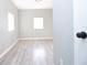 This bedroom features neutral walls and bright natural light at 1328 3Rd Ne St, Winter Haven, FL 33881