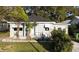 Charming single-story home with a well-maintained lawn, and a welcoming front porch at 1328 3Rd Ne St, Winter Haven, FL 33881
