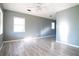Bright and airy living room with neutral walls, laminate flooring, and natural light at 1328 3Rd Ne St, Winter Haven, FL 33881