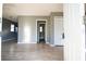 Bright living room featuring gray walls, light-colored laminate flooring, and plenty of natural light at 1328 3Rd Ne St, Winter Haven, FL 33881