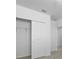 Bedroom closet with sliding doors and built-in shelving for storage at 1340 Oak Valley Drive, Auburndale, FL 33823