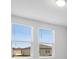 Bright bedroom with windows showcasing an exterior view at 1340 Oak Valley Drive, Auburndale, FL 33823
