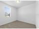 Cozy bedroom with plush carpeting, a window, and neutral paint colors at 1340 Oak Valley Drive, Auburndale, FL 33823