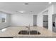 Well-lit kitchen with stainless steel appliances and granite countertops at 1340 Oak Valley Drive, Auburndale, FL 33823